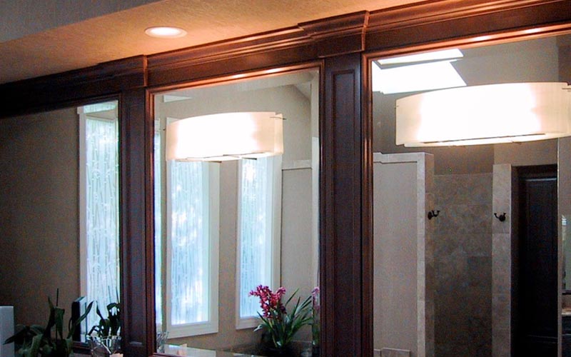 Residential master bathroom: installation of mirror fixtures